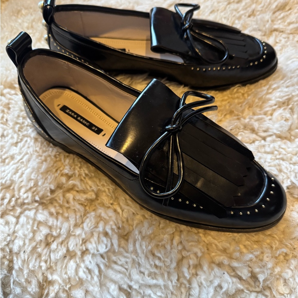 Zara Black Flats with Glossy Finish and Tassel Detail